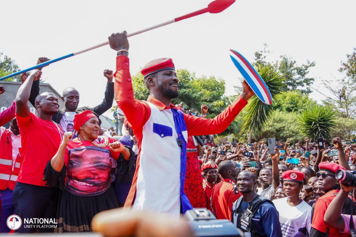 Kyagulanyi in Kasese District showing his bow and spear given to him by residents