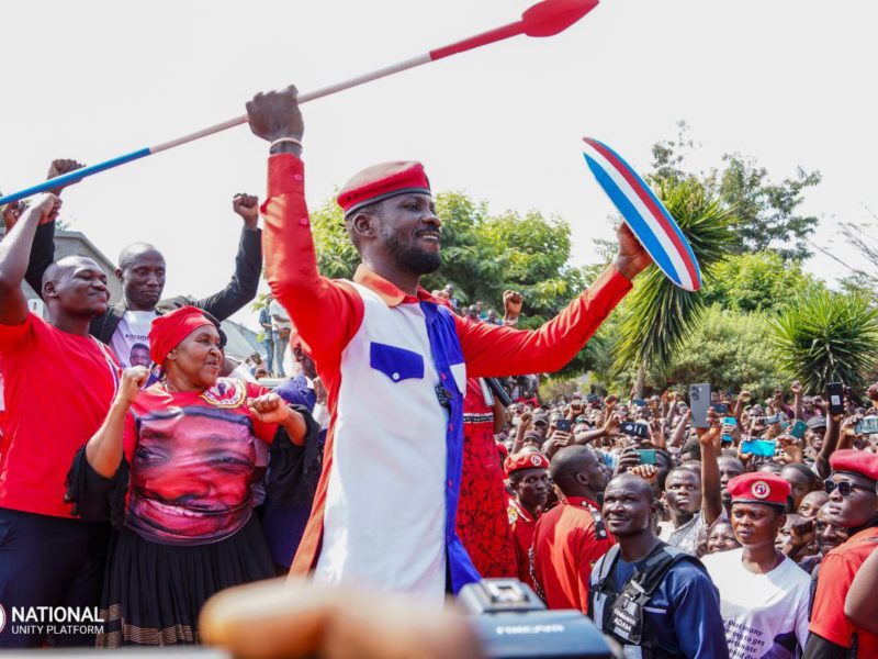 Kyagulanyi in Kasese District showing his bow and spear given to him by residents