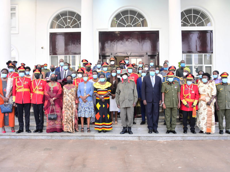Gen. Museveni poses with retired Army officials in front of State House on Thursday